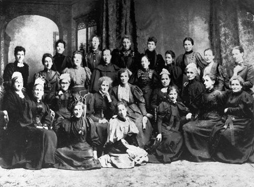 A photograph of a group of seated women