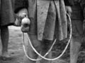 Children with a skipping rope, around 1940