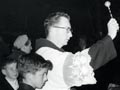 Catholic community life: blessing cars, Lower Hutt, 1958