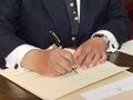 Governor-general signing the writ for an election