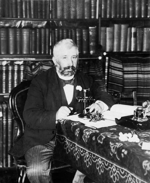 Thomas Morland Hocken in his library, 1893