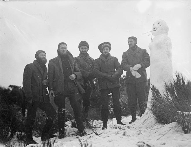 Coast-watchers with snowwoman, Auckland Islands, 1942