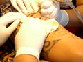 Woman tattoo artist at work