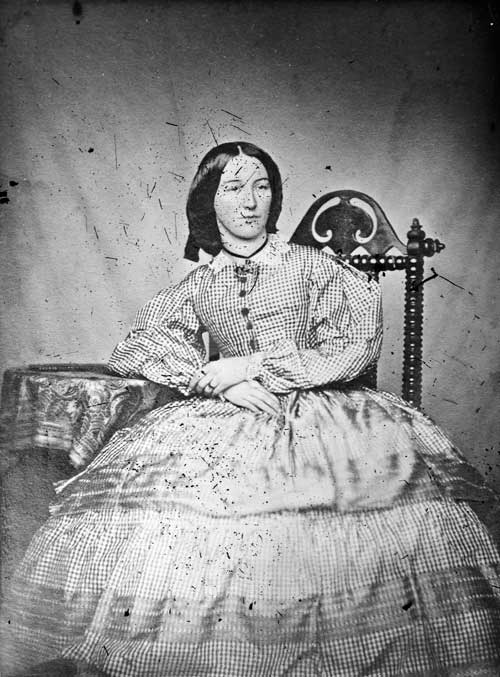 Woman wearing a crinoline dress, 1860
