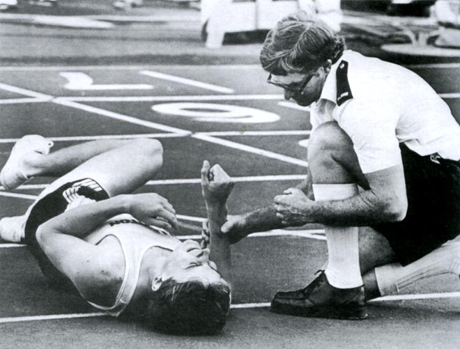 St John officer treating an athlete, 1989