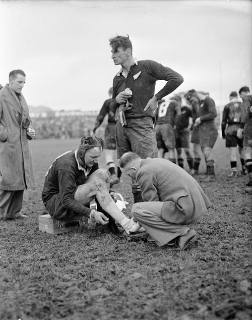 Volunteer doctor at rugby test, 1950
