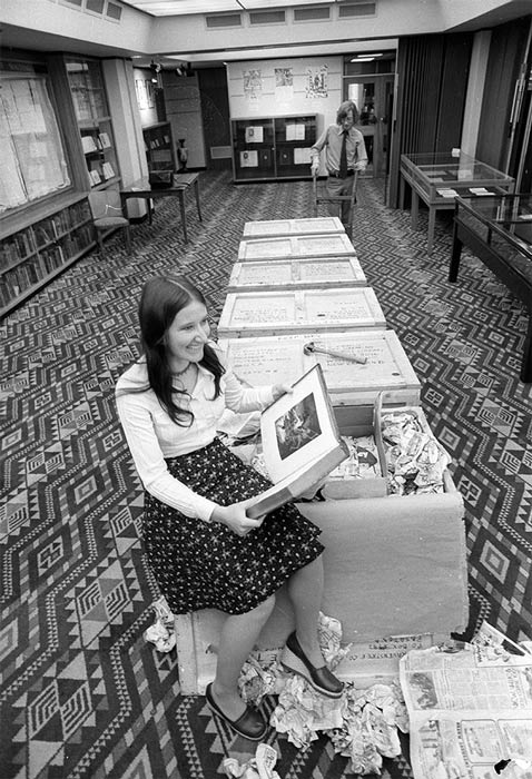 Unpacking a John Milton collection, Alexander Turnbull Library, 1975