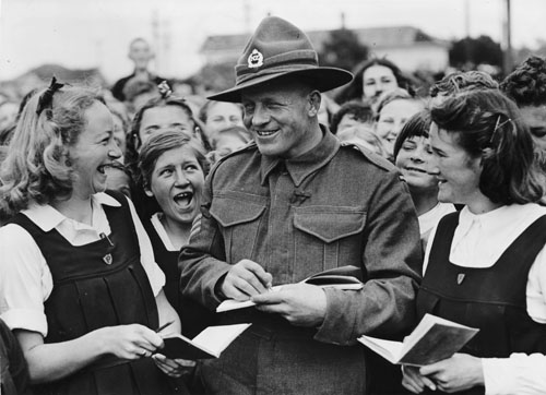 Alfred Clive Hulme signing autographs for schoolgirls