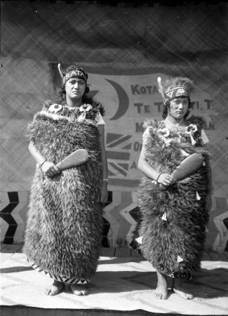 Maata Rātana (left) and her sister, Piki-te-ora, photographed in traditional dress before their departure overseas, 1924