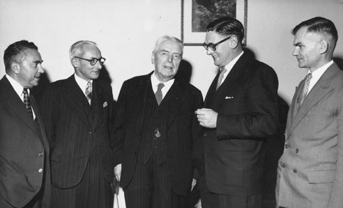Jacob Meltzer (left), Walter Nash (centre) and members of New Zealand's Olympic management, 1958