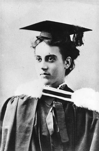 Portrait photo of Emily Siedeberg in graduation gown and wearing mortarboard cap