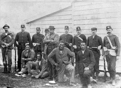 Hōne Riiwi Tōia (standing, centre) and four supporters after their arrest, May 1898