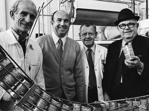James Wattie (right) with staff in one of his factories, 1972