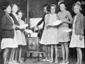 Girls at the Sunlight League's Christchurch health camp line up for porridge, January 1936