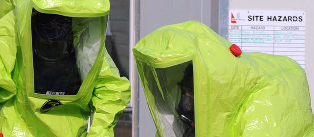 Members of the Chemical Biological Radioactive Explosive (CBRE) team in HazChem suits, May 2008