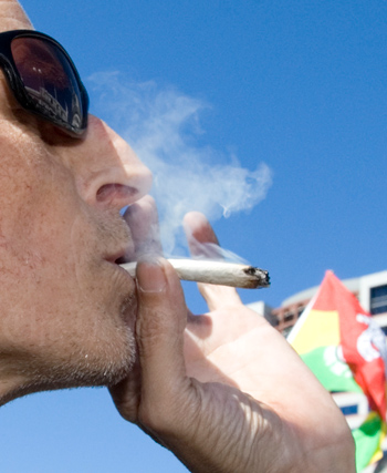 Taking a puff of cannabis during a pro-legalisation rally, Parliament, 2010
