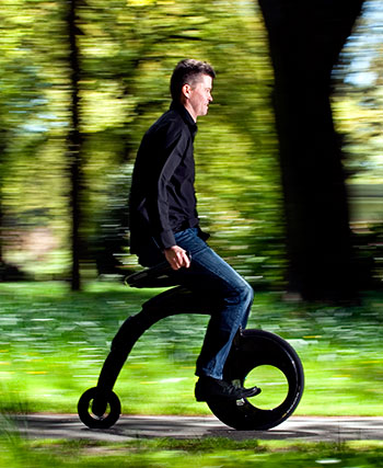 Greg Ryan riding his invention, the YikeBike