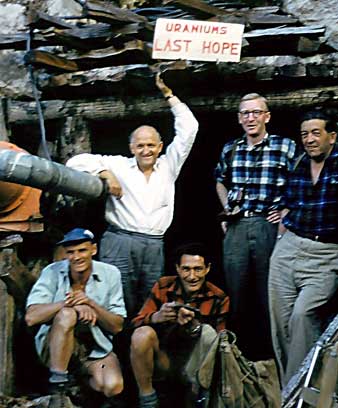 Prospectors pose outside a tunnel given the name ‘Uraniums Last Hope’