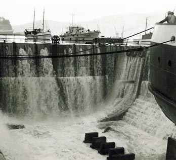 Water pouring into Lyttelton dry dock during the 1960 tsunami
