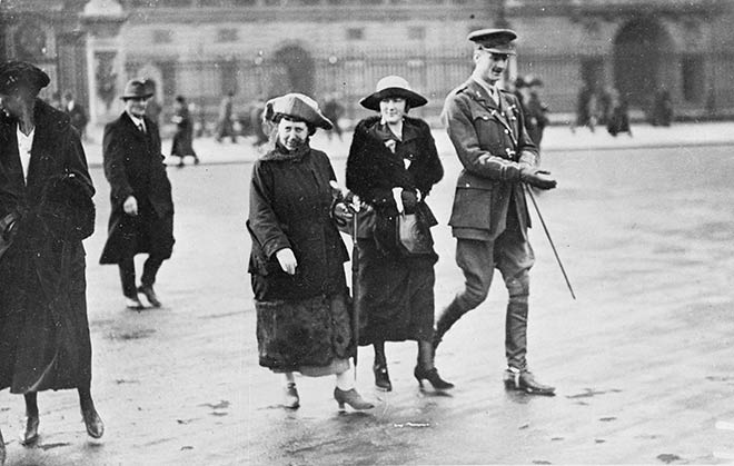 Photograph of Frances Hodgkins, her niece, Lydia and Noel Pharazyn crossing the street outside Buckingham Palace
