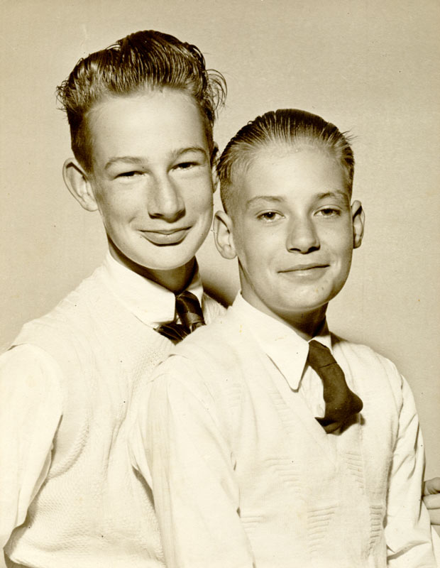 A head and shoulders studio portrait of Ian and Tony Athfield as children