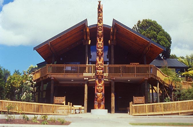 Large visitors centre with a central pou with Maori carvings and large verandahs. 
