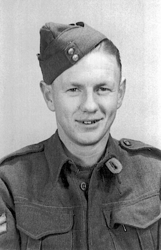 A head and shoulders studio portrait of Bill Pearson wearing a military uniform. 