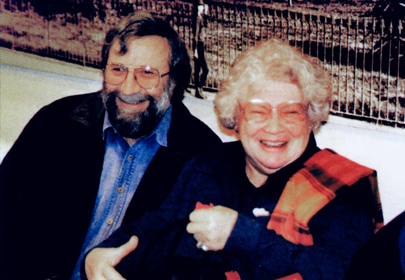 Michael King and Janet Frame, seated beside each other and smiling broadly.