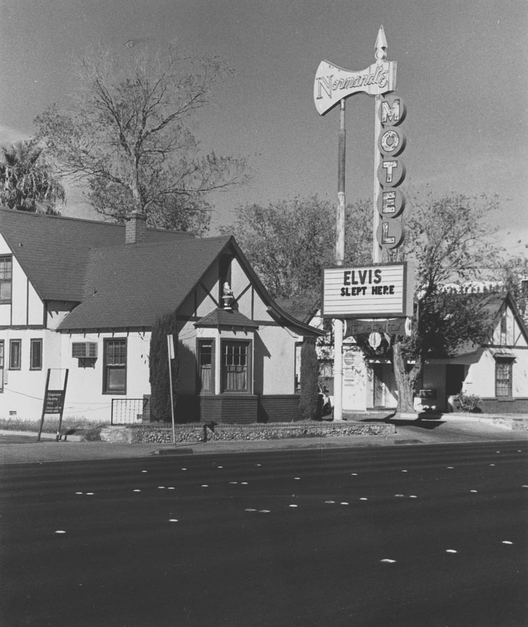 A photograph of the Normandie Motel, which features a billboard saying, ‘Elvis slept here’.