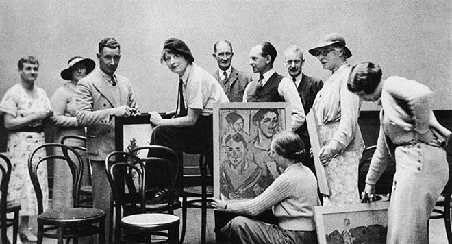 A group photograph of artists with easels