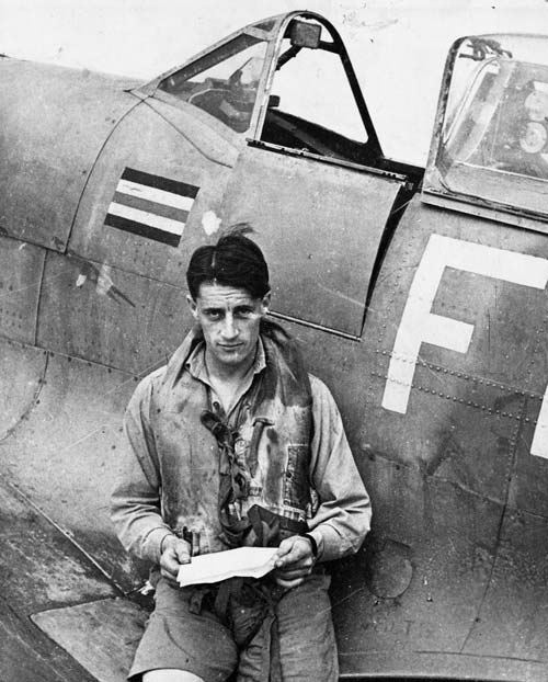 Colin Falkland Gray photographed alongside his Spitfire aeroplane during the Second World War