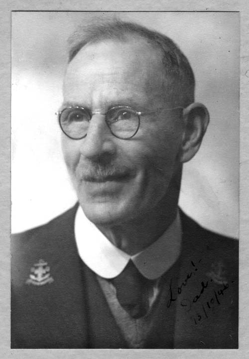 A head and shoulders studio photograph of Horace Grocott in later life