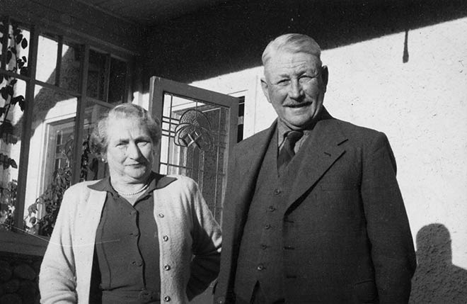 Sir William Mulholland and Lady Mulholland outside the home on their farm, Ladybank, at Darfield, Canterbury, about 1956