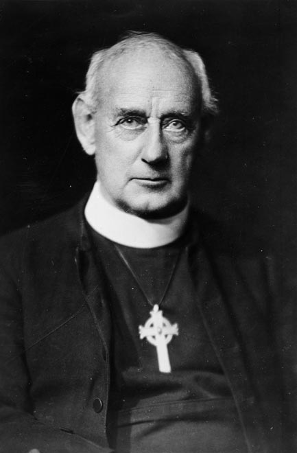 Herbert Williams wearing a clerical dog collar.