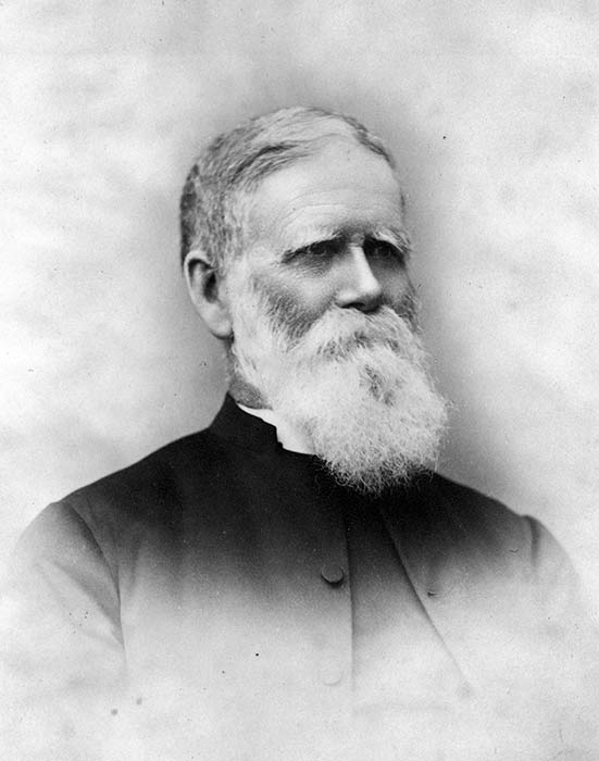Samuel Williams with a heavy beard and wearing clerical garb.