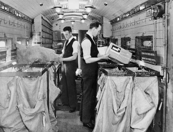 Sorting mail in a railway carriage, 1930s