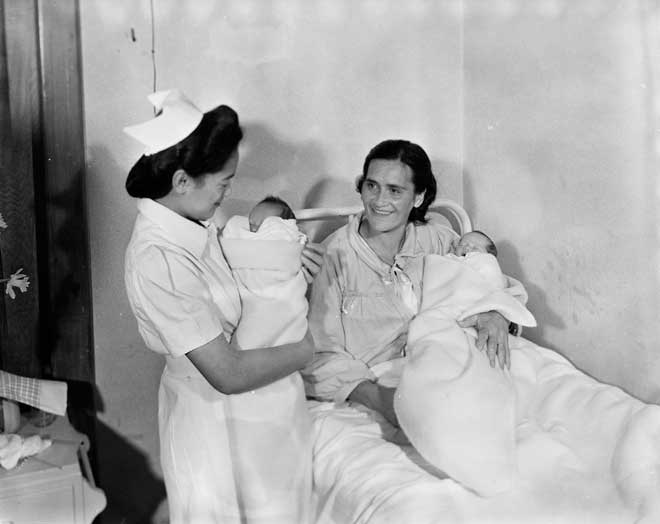 Nurse with mother and twins