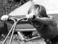 Boys mowing the lawn, 1970