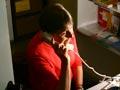 Woman in a room talking on the telephone.