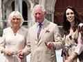 Prince of Wales stands between his wife, the Duchess of Cornwall, and New Zealand Prime Minister Jacinda Ardern on steps outside the Christchurch Cathedral.
