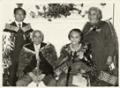 Carver Wiremu Te Ranga (Piri) Poutapu (seated, left) after receiving the MBE honour in 1974