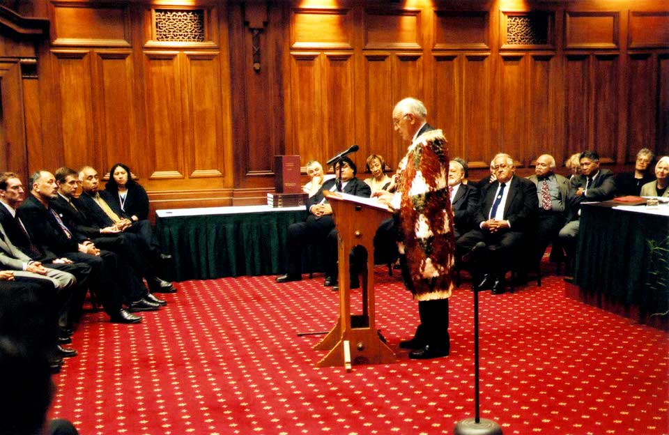 Sir Hirini Moko-Mead addresses those gathered for the Ngāti Awa Deed of Settlement signing, 2003. Image supplied by <a href='https://www.ngatiawa.iwi.nz/' class='external-link' target='_blank' rel='noopener'>Te Rūnanga o Ngāti Awa</a>