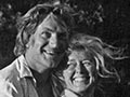 Harry and Nan Turbott together on horseback, smiling happily. 