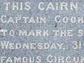 Photo of memorial plaque with text, dated 1920, memorializing Cook's visit in 1770 when the British flag was raised