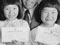 A Korean family with their certificates of citizenship