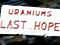 Prospectors pose outside a tunnel given the name ‘Uraniums Last Hope’