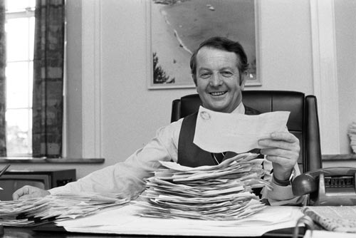 Bill Rowling reading congratulatory telegrams