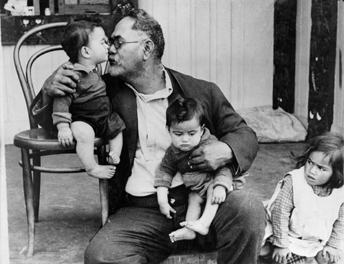 Māori grandfather with grandchildren