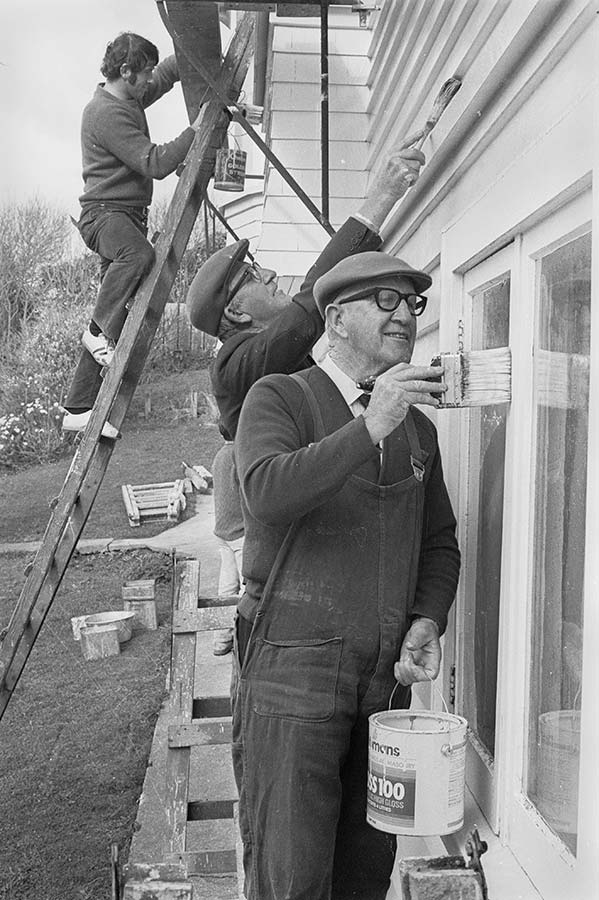 Arnold Nordmeyer painting a Presbyterian manse