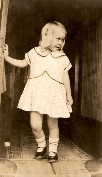 Young girl inside hall of house